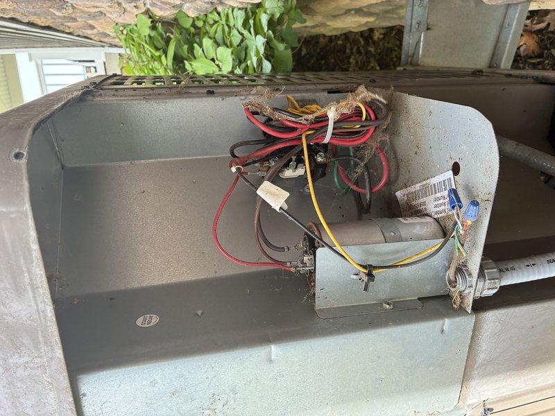 Completed scheduled cooling system maintenance visit. Performed comprehensive inspection of outdoor condensing unit including electrical disconnect switch, control wiring, and internal electrical components. Verified proper operation of safety disconnect mechanism and examined all wire connections within the unit's electrical compartment. All electrical connections found secure with appropriate wire terminations. System operational and ready for continued service.