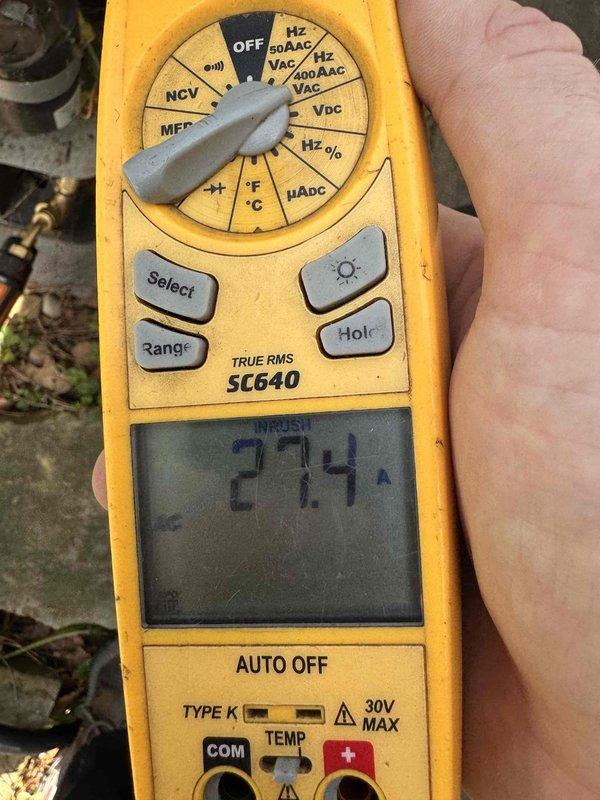 Responded to service call for central air conditioning unit not blowing cold air. Upon arrival, performed comprehensive system diagnostics using digital clamp meter to measure electrical parameters. Recorded compressor amperage draw at 2.88 amps and monitored inrush current readings at 27.4 amps to assess motor and compressor performance. Inspected electrical connections, wiring integrity, and component operation at outdoor condensing unit. Completed full HVAC system service including refrigerant level verification, airflow assessment, and overall system performance evaluation. All measurements indicated proper electrical function within manufacturer specifications. System restored to normal cooling operation and tested for proper temperature differential across evaporator coil.