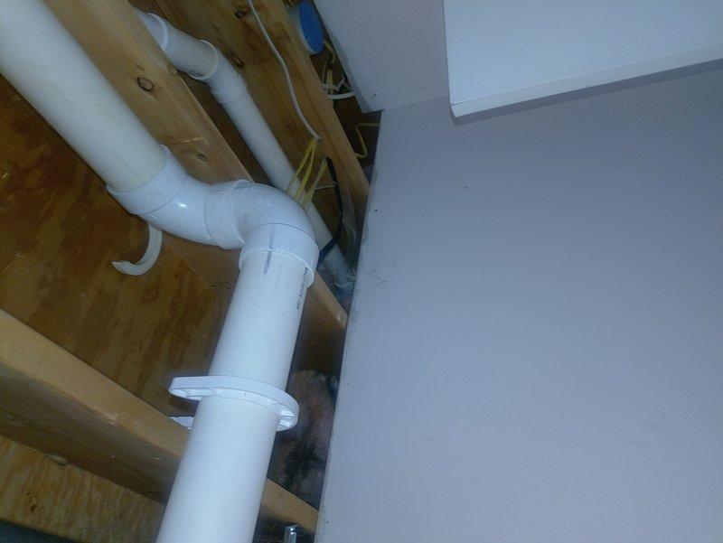 Responded to water leak complaint on 2-year-old natural gas furnace where water was observed discharging from the exhaust pipe. Upon inspection, identified condensate drainage issue affecting the PVC vent piping system. Examined the condensate drain line configuration in the ceiling cavity and verified proper installation of drain components and connections. Addressed drainage concern to prevent water discharge through the exhaust termination. System operational upon completion, with condensate properly routed through designated drain lines.