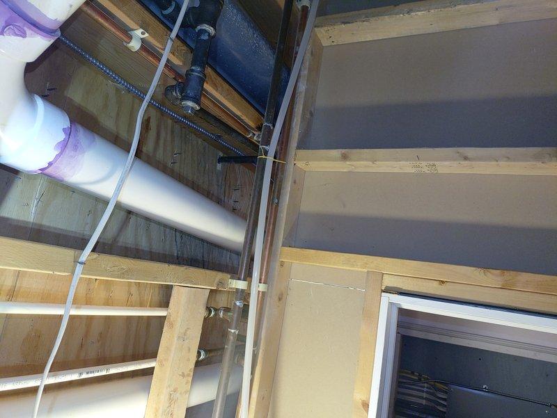 Responded to water leak complaint on 2-year-old natural gas furnace where water was observed discharging from the exhaust pipe. Upon inspection, identified condensate drainage issue affecting the PVC vent piping system. Examined the condensate drain line configuration in the ceiling cavity and verified proper installation of drain components and connections. Addressed drainage concern to prevent water discharge through the exhaust termination. System operational upon completion, with condensate properly routed through designated drain lines.