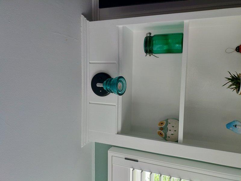 Restored power to non-functional front house light by running new power from attic source to switch relocated in nook back wall and installing switch leg to customer-supplied fixture. Extended mudroom outlet circuit to install new exterior deck outlet. Expanded kitchen GFCI location to two-gang configuration, added light switch, and re-fed switch leg to rear house light. Ran power from basement up through wall cavity and installed high-mounted exterior outlet for retractable deck shade power supply.