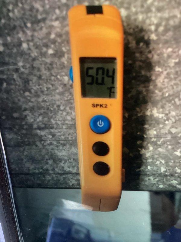 Responded to no cooling complaint following recent tune-up service. Upon arrival, inspected Lennox outdoor condensing unit and performed diagnostic testing. Measured supply air temperature at 50.4°F, confirming adequate cooling performance and proper system operation. Unit found operating within normal parameters with no issues identified.