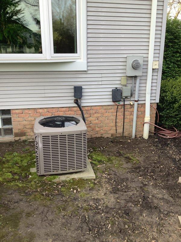 Completed full HVAC system installation including 90% efficiency furnace, air conditioning condenser unit, and humidifier. Installed outdoor AC condenser on concrete pad with proper electrical connections, mounted junction boxes on exterior siding, and ran appropriate conduit for power supply. Inside mechanical room, installed air handler with associated ductwork, configured PVC condensate drainage system with multiple drain lines, and integrated humidifier into the system. All electrical disconnects properly installed and labeled, equipment secured and leveled, and system tested for proper operation upon completion.