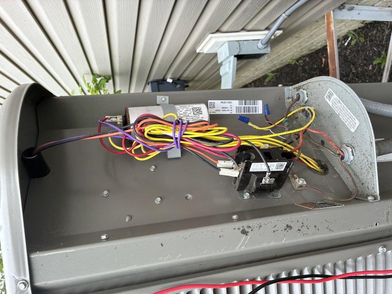 Completed scheduled BS-MVP cooling maintenance visit on 4-year-old outdoor HVAC system. Performed comprehensive inspection of air handler unit, including examination of blower motor assembly, electrical connections, and control board components. All wiring connections were secure with no signs of overheating or degradation. Verified proper operation of blower motor and associated relay modules. Inspected heat exchanger coils and found them in acceptable condition with normal accumulation of outdoor debris. Checked exterior electrical disconnect box and noted heavy condensation present on exterior surface, consistent with high humidity conditions. All system components operating within normal parameters. Unit functionality confirmed with no immediate service needs identified.