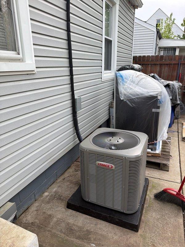 Completed full HVAC system installation including 80% efficiency furnace and air conditioning system. Installed new Lennox condenser unit on exterior concrete pad with proper refrigerant line routing along building exterior, and positioned indoor furnace unit in utility room with connection to existing ductwork. Set up condensate pump and drainage system to handle moisture removal from cooling operations.