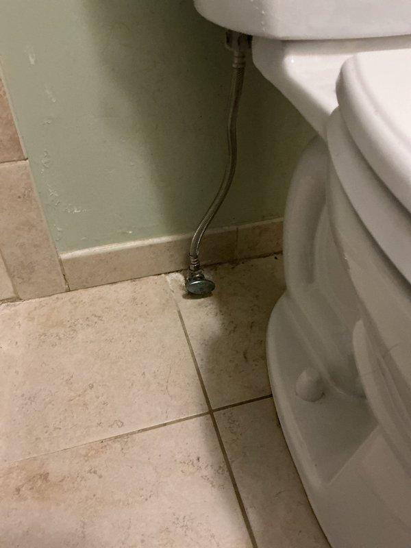 Removed existing toilet and installed new American Standard Cadet Pro comfort height model with elongated bowl. Replaced wax ring and mounting bolts during installation to ensure proper seal and stability. Reused existing toilet seat per homeowner request and reconnected water supply line to complete the installation.