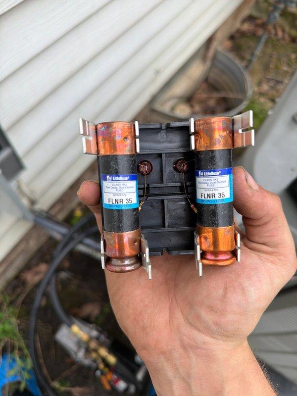 Completed first-time heat pump installation at residential property. Installed Lennox outdoor heat pump unit on equipment pad with proper electrical disconnect, copper refrigerant line set with shut-off valves, and Littelfuse FLNR 35 amp fuses for overcurrent protection. System tested and operational upon completion.