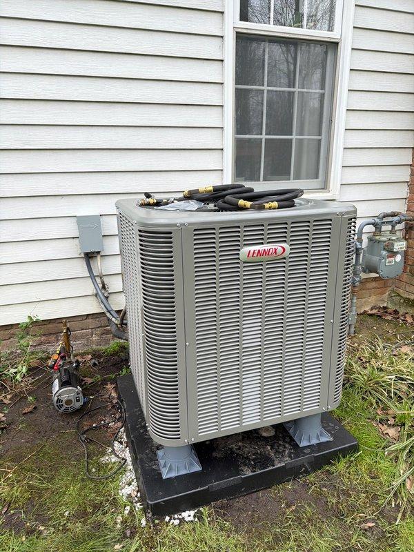 Completed first-time heat pump installation at residential property. Installed Lennox outdoor heat pump unit on equipment pad with proper electrical disconnect, copper refrigerant line set with shut-off valves, and Littelfuse FLNR 35 amp fuses for overcurrent protection. System tested and operational upon completion.