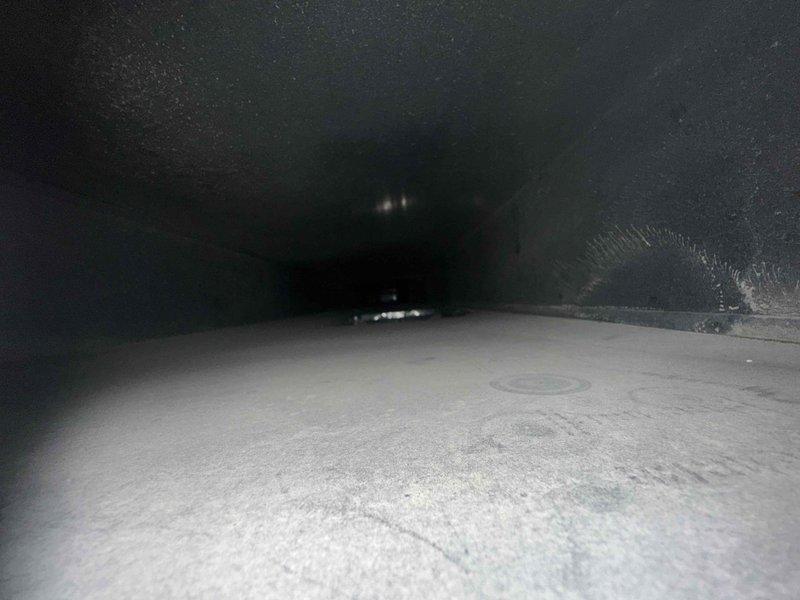 Completed residential duct cleaning service for HVAC system covering up to 14 vents as part of maintenance plan. Pre-service inspection revealed significant dust and debris accumulation throughout the ductwork system, with visible buildup on interior surfaces and metal flooring of rectangular supply ducts. Performed comprehensive cleaning of all accessible ductwork, removing accumulated particulate matter and contaminants from supply and return vents to improve air quality and system efficiency.