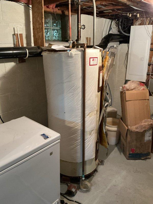 Responded to no water complaint in kitchen. Upon arrival, inspected kitchen faucet and verified lack of water flow at fixture. Traced supply lines to basement utility area and located water heater with associated plumbing connections. Assessed water distribution system including supply valves and piping connections. Documented existing conditions of kitchen sink fixture, supply lines, and basement mechanical equipment for service records.