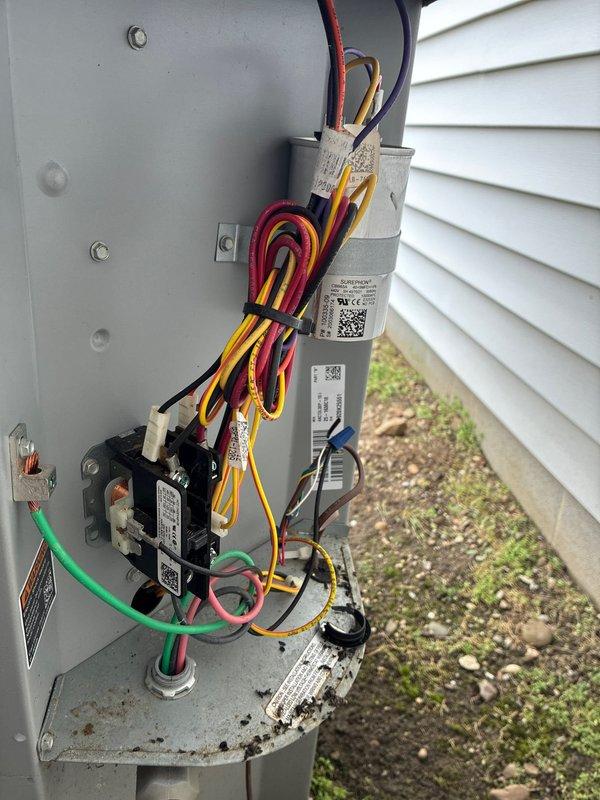 Performed comprehensive preventive maintenance on a five-year-old residential air conditioning system. Conducted complete system inspection including blower assembly evaluation, where moderate dust accumulation was observed on fan blades and housing. Inspected electrical components including contactor, dual capacitors, and wiring connections; all components found to be in good working condition with proper wire management and grounding. Verified system operation and confirmed unit is functioning within normal parameters.