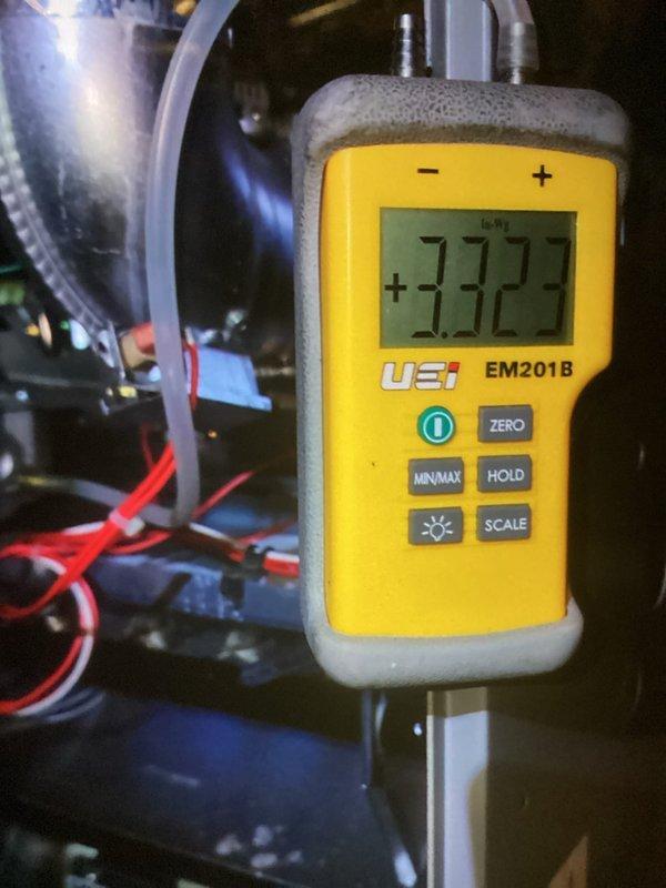 Completed AC tune-up on 5-year-old system and discovered evaporator coil with severe frost buildup indicating restricted airflow or low refrigerant charge. Documented frozen coil condition with temperature readings using digital thermometer showing significant temperature differential. Recommended further diagnostics to determine root cause of icing issue, which may include checking refrigerant levels, verifying proper airflow across coil, and inspecting for potential restrictions in the system.