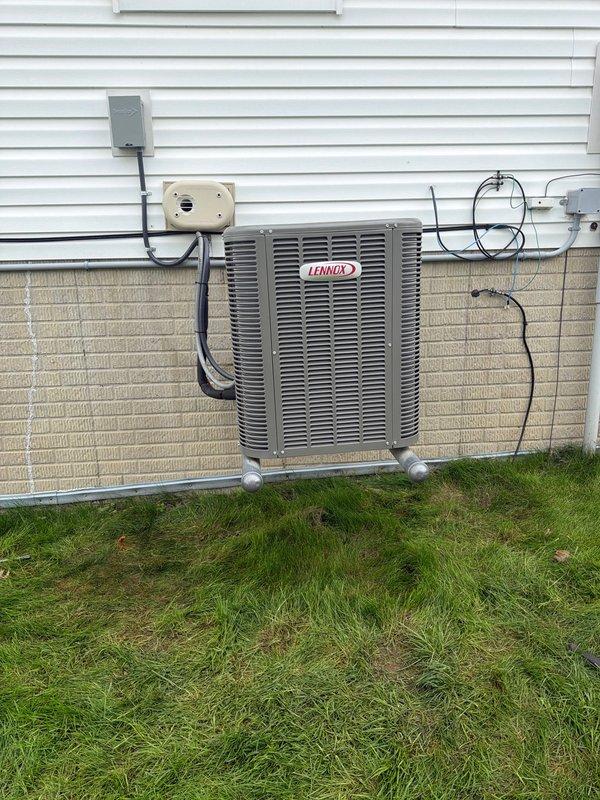 Completed full HVAC system installation including a new Lennox 90% AFUE gas furnace and air conditioning unit. Installed outdoor condensing unit on concrete pad with proper clearances, ran and terminated all electrical connections including disconnect switch and conduit, and installed Kidde carbon monoxide detector per safety code requirements for fossil fuel burning appliances.