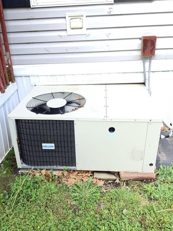 Responded to service call for 15-year-old residential air conditioning unit with reported refrigerant leak. Performed visual inspection of outdoor condensing unit and accessed air handler components to identify potential leak points. Unit showed signs of age-appropriate wear with accumulated debris around coil areas requiring further diagnostic testing to locate and confirm refrigerant leak source.
