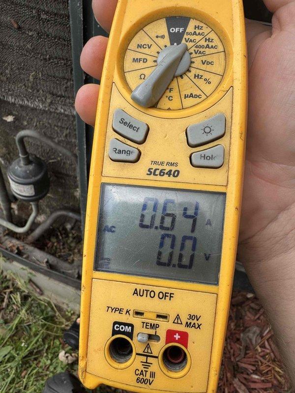 Completed scheduled preventive maintenance cooling visit on 11-year-old air conditioning system. Performed comprehensive system inspection and diagnostics using clamp meter to verify electrical performance, measuring amperage draw and voltage at outdoor condensing unit. Observed significant corrosion and rust on compressor terminal connections and top plate of outdoor unit, indicating extended exposure to weather elements. Documented equipment condition through photos showing deteriorated motor terminals and corroded mounting points. System operational at time of service, though terminal corrosion noted as area requiring future attention to prevent electrical failure.