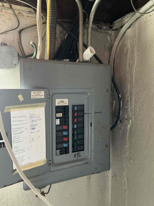 Completed on-site electrical estimate for Kohler generator installation. Assessed existing electrical panel configuration with multiple circuit breakers and documented current service entrance equipment including meter location and weatherhead installation. Photographed electrical infrastructure to determine generator transfer switch placement requirements and confirm adequate electrical capacity for automatic standby generator system integration with residential service.