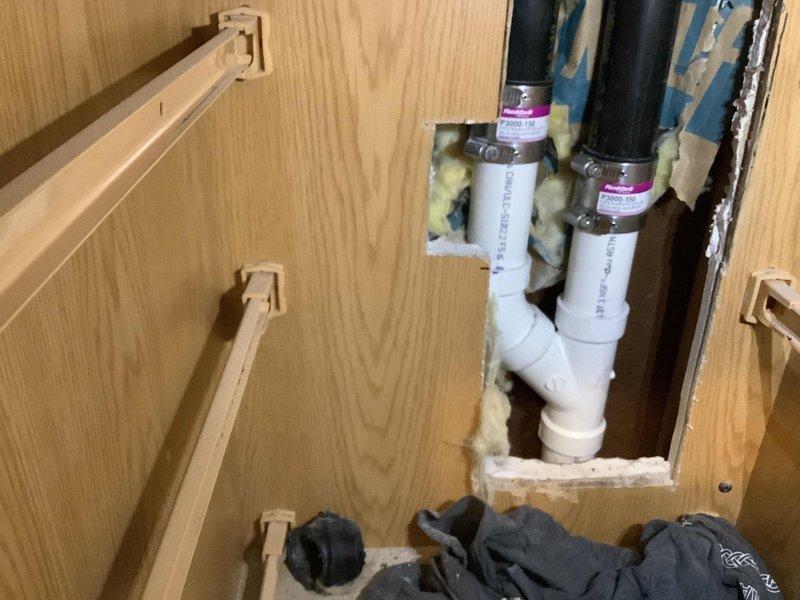 Responded to callback for kitchen sink leak. Upon inspection, accessed plumbing through cabinet and identified leaking drain connections beneath sink. Installed two 2" Fernco caps as planned to repair damaged drain piping. Secured all connections with proper clamps and verified system integrity. Leak successfully resolved and plumbing restored to proper working condition.