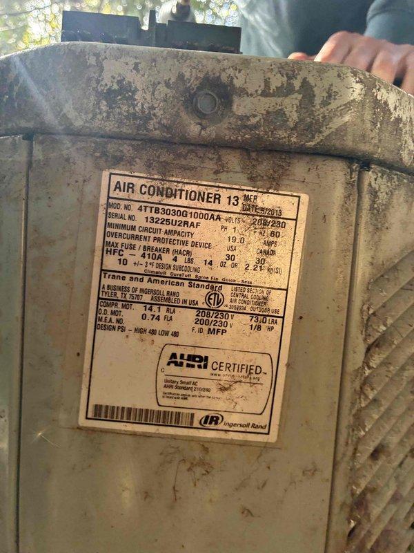 Completed comprehensive AC tune-up on aging Trane 13 SEER outdoor condensing unit (Model 4TTR3030G1000AA) showing significant weathering and over 15 years of service. Performed standard maintenance protocol including inspection of electrical components, fan motor operation, refrigerant levels, and overall system functionality to ensure continued reliable cooling performance.