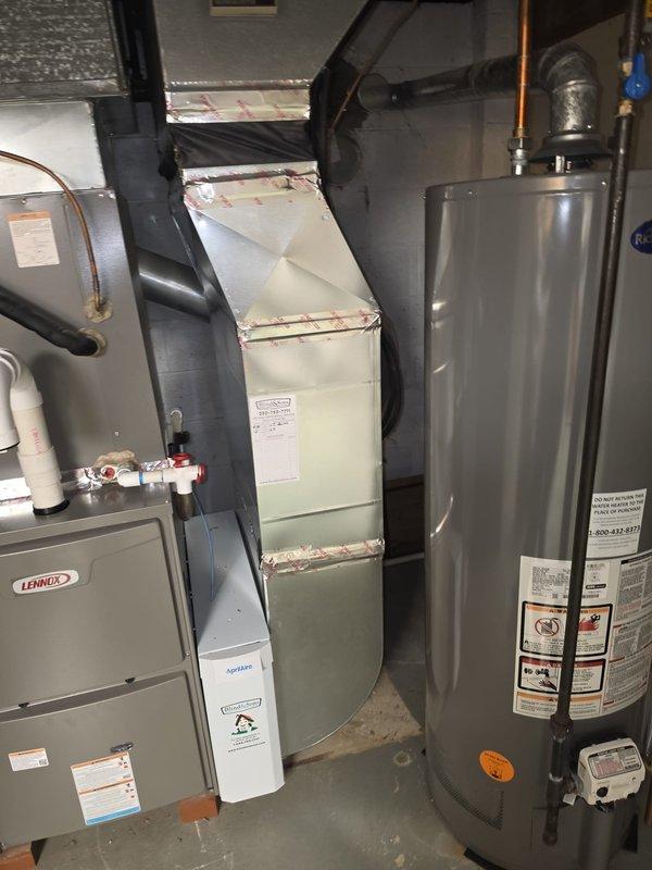 Completed installation of Lennox 90% efficiency furnace as part of secondary installation phase. Unit installed in basement mechanical room with proper electrical connections, flexible conduit routing, PVC venting, and condensate drainage system. All components tested and operational upon completion.