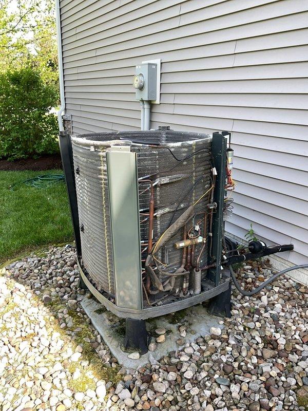 Completed MVP recurring maintenance visit for both heating and cooling systems that had been rescheduled from a previous date. Performed comprehensive inspection and maintenance on outdoor air conditioning condenser unit, including removal of protective grille to access internal components for thorough evaluation. Inspected copper refrigerant lines, coils, electrical connections, and mechanical components for proper operation and wear. Verified electrical disconnect and conduit connections. Assessed unit condition, noting age-related wear and discoloration on copper tubing. Checked concrete pad stability and surrounding drainage area. Reassembled unit upon completion of maintenance procedures. System operational and ready for cooling season.