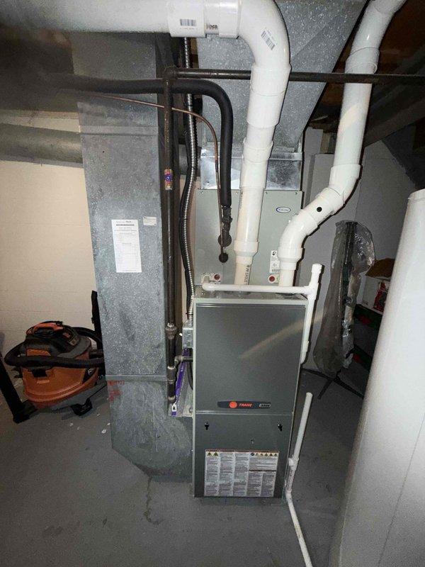 Completed scheduled preventive maintenance on 10-year-old Trane HVAC system for MVP customer. Performed comprehensive inspection of furnace, air handler, and associated electrical controls, verifying all components operational and connections secure. Documented system condition with photos showing proper installation of PVC ventilation lines and control board wiring configuration.