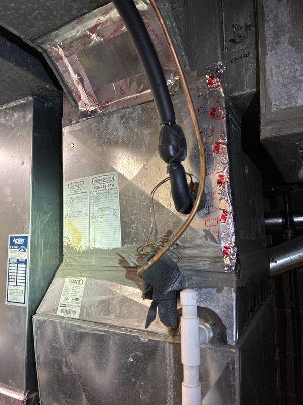 Completed BS-MVP preventive maintenance cooling visit on 5-year-old residential HVAC system. Inspected Lennox outdoor condensing unit and green air handler located in attic space. Verified proper operation of both components, checked refrigerant lines for leaks and proper insulation, inspected condensate drain line for clogs, and confirmed all electrical connections were secure. System operating within normal parameters with no issues found.