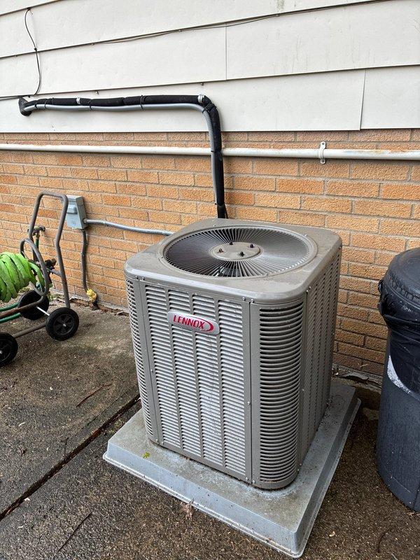 Completed BS-MVP preventive maintenance cooling visit on 5-year-old residential HVAC system. Inspected Lennox outdoor condensing unit and green air handler located in attic space. Verified proper operation of both components, checked refrigerant lines for leaks and proper insulation, inspected condensate drain line for clogs, and confirmed all electrical connections were secure. System operating within normal parameters with no issues found.