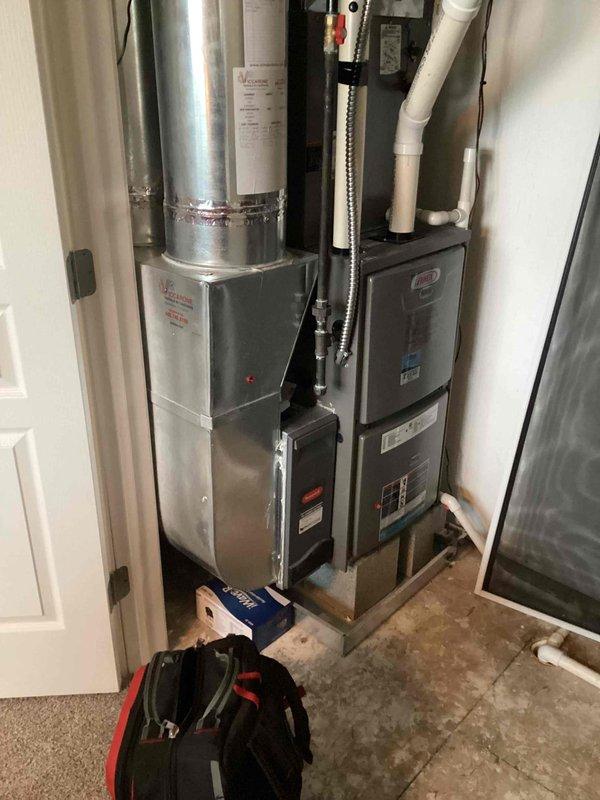 Completed annual air conditioning tune-up on a ten-year-old residential system located in utility closet. Performed comprehensive inspection of indoor air handler unit, verified proper electrical connections, cleaned condensate drain line, checked refrigerant levels, and tested system operation. All components found to be functioning within normal parameters with no immediate service needs identified.