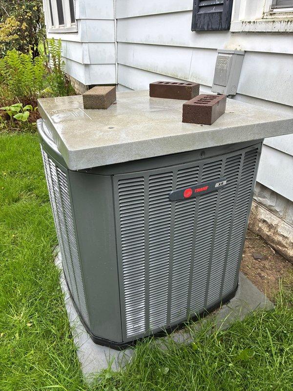 Completed BS-MVP recurring cooling maintenance visit on Trane outdoor condensing unit. Performed standard preventive maintenance procedures including inspection of electrical control panel, verified proper operation of control boards and capacitor connections, and assessed outdoor unit condition. All system components found operating within normal parameters with no immediate service needs identified.