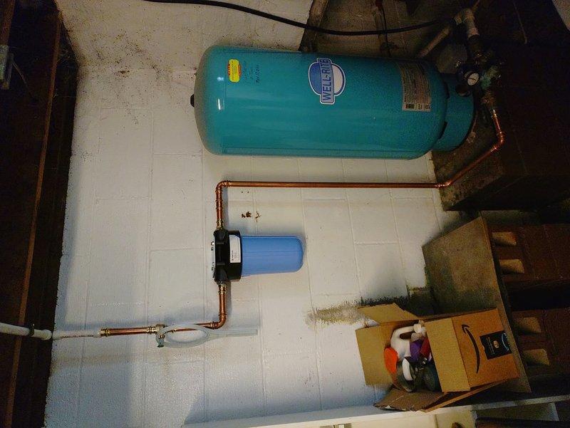 Completed comprehensive water line replacement throughout the residence, installing new PEX piping from the well shut-off valve to all dedicated fixtures on the first level, including new shut-offs and stub-ups for kitchen, bathroom sink, and toilet. Rerouted utility sink waterlines to accommodate faucet relocation while maintaining sink position, installed wall-mounted utility sink unit, and replaced boiler drains for washing machine hookup with new hose lines. Removed basement toilet and installed t-cone cap, eliminated redundant water line run to front portion of home, and tied new PEX lines into existing shower runs which retained original shut-offs in serviceable condition.

Installed new shut-off valve for exterior spigot to improve accessibility and control. Replaced failing condensate pump on air conditioning system to ensure proper drainage. Installed whole home water filtration system with replacement filter to improve water quality throughout the residence. Added multiple sh