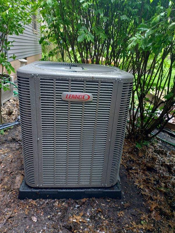 # HVAC Install - Complete System

Completed installation of Lennox 90% efficiency furnace with 5-ton air conditioning system. Positioned outdoor condensing unit on concrete pad with proper clearances for airflow and service access. Installed refrigerant line set with appropriate insulation, secured copper piping connections, and installed service valves at unit base for future maintenance access. Configured condensate drainage system and verified all electrical connections. Unit tested and confirmed operational with proper airflow through louver grilles. System commissioned and ready for service in residential application.