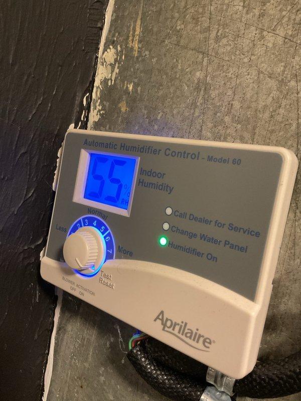 Completed scheduled furnace tune-up and maintenance on a two-and-a-half-year-old heating system. Inspected and serviced all major components, including air filtration system which showed moderate dust accumulation with visible discoloration in the lower quadrant of the filter media. Checked Aprilaire Model 60 Automatic Humidifier Control unit, confirmed operational status with humidifier actively running at 35% humidity setpoint and green indicator light illuminated. All system components tested and verified to be functioning within normal parameters.
