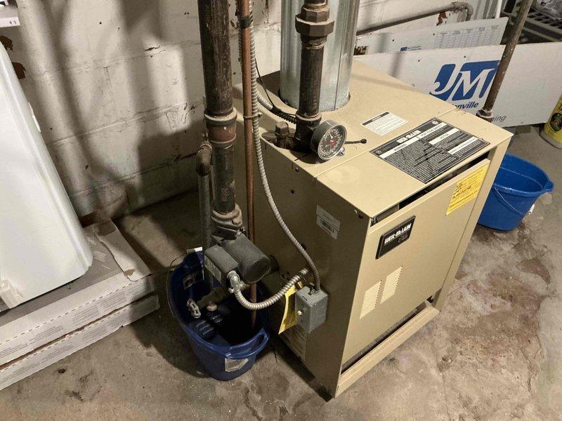 Completed estimate for high-efficiency boiler replacement to eliminate chimney venting requirements. Assessed existing Weil-McLain boiler system with associated piping network showing significant corrosion on horizontal supply lines, evaluated mechanical room layout including water heater and existing infrastructure, and documented current installation conditions. Provided recommendations for new high-efficiency condensing boiler system with PVC venting to address customer's need to move away from chimney dependency.