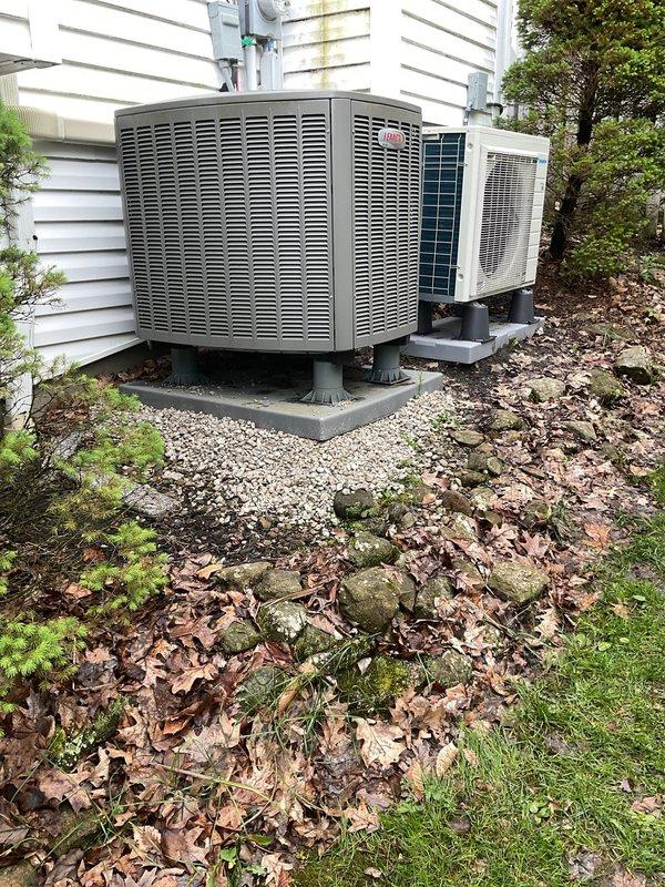 Returned to property to level outdoor air conditioning unit that had settled unevenly on its concrete pad. Applied gravel base material from warehouse inventory beneath and around the equipment pad to ensure proper drainage and stability. Work was performed during appropriate weather conditions with temperatures consistently at or above 65 degrees as required for safe installation. Completed exterior work without requiring interior access to the residence. Both HVAC units now sit level on stabilized concrete pads with adequate gravel bedding for long-term support and water management.