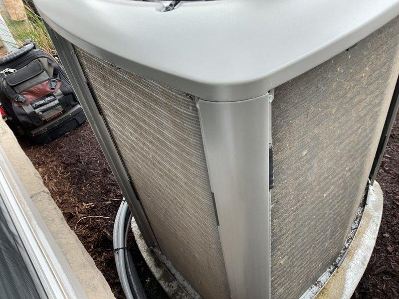 Performed comprehensive AC tune-up on residential outdoor condensing unit approximately 3-4 years old. Conducted full system inspection including electrical connections, refrigerant lines, condenser coil cleaning, and fan operation verification. Unit found in good working condition with proper clearances maintained; all components operating within normal parameters and system ready for cooling season.