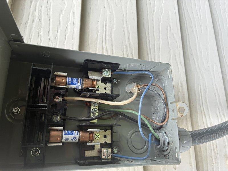 Completed routine MVP cooling maintenance visit on Carrier air conditioning system. Performed comprehensive inspection of outdoor condensing unit and electrical disconnect components, verifying proper operation of condenser fan assembly, checking cartridge fuse integrity, and confirming secure electrical connections throughout the system. All components found in good working condition with unit operating within normal parameters.