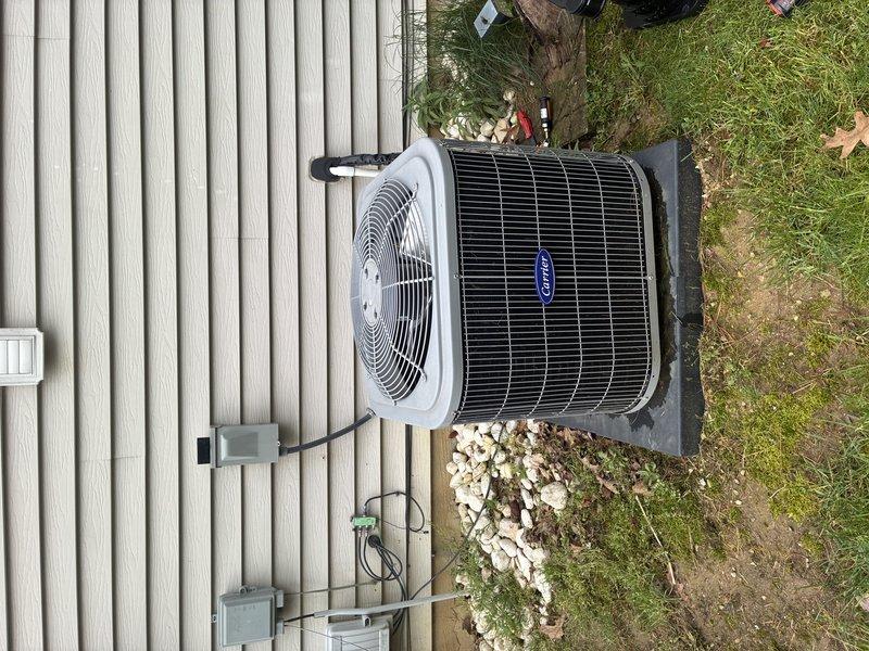 Completed routine MVP cooling maintenance visit on Carrier air conditioning system. Performed comprehensive inspection of outdoor condensing unit and electrical disconnect components, verifying proper operation of condenser fan assembly, checking cartridge fuse integrity, and confirming secure electrical connections throughout the system. All components found in good working condition with unit operating within normal parameters.