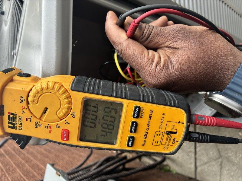 # HVAC Maintenance - Cooling

Performed comprehensive air conditioning maintenance service on residential cooling system. Conducted thorough electrical diagnostics using digital clamp meter to verify proper amperage draw and voltage levels across compressor and condenser fan motor circuits. Measured and documented electrical readings to ensure system components were operating within manufacturer specifications.

Inspected outdoor condensing unit, examining all electrical connections, contactors, and capacitor for signs of wear, corrosion, or degradation. Verified proper wiring connections and tested capacitor microfarad values to confirm adequate starting and running capacity for compressor and fan motor. All electrical measurements indicated system was functioning correctly with no component failures detected.

System tested and confirmed operational. All components operating within normal parameters with no immediate service needs identified.