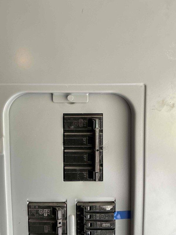 Conducted comprehensive electrical assessment for generator installation at residential property. Evaluated existing electrical panel configuration, verified available breaker capacity, and documented current electrical infrastructure including conduit routing and connection points in garage area. Photographed panel layout showing multiple circuit breakers and assessed structural considerations for generator tie-in to existing system.