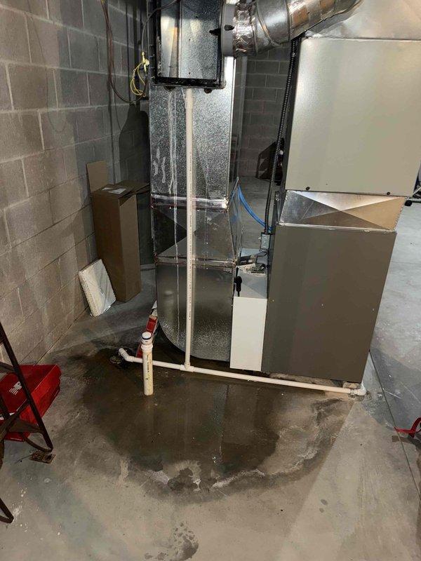 Completed seasonal maintenance on AC system and humidifier as requested. Upon inspection, discovered severely corroded evaporator coil with significant rust damage and deterioration of the heat exchanger fins, indicating prolonged moisture exposure. Also observed substantial water pooling on basement floor around HVAC equipment base, suggesting active drainage issues or condensate line problems that likely contributed to the coil corrosion. Documented conditions with photos and advised customer of findings requiring immediate attention to prevent system failure.