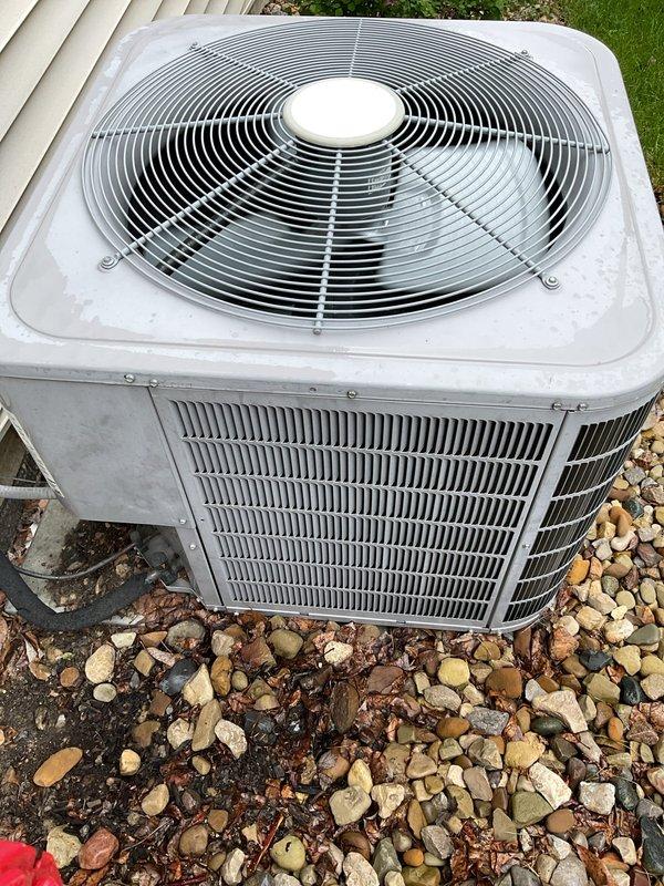 Completed routine MVP cooling maintenance visit on residential air conditioning system. Performed comprehensive inspection of outdoor condenser unit, including visual assessment of cabinet condition, fan assembly, and electrical connections. Verified proper wiring configuration at capacitor terminals and documented system components through photographic records. Unit operational with no immediate service requirements identified.