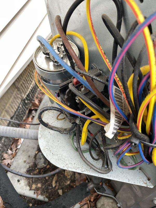 Completed routine MVP cooling maintenance visit on residential air conditioning system. Performed comprehensive inspection of outdoor condenser unit, including visual assessment of cabinet condition, fan assembly, and electrical connections. Verified proper wiring configuration at capacitor terminals and documented system components through photographic records. Unit operational with no immediate service requirements identified.