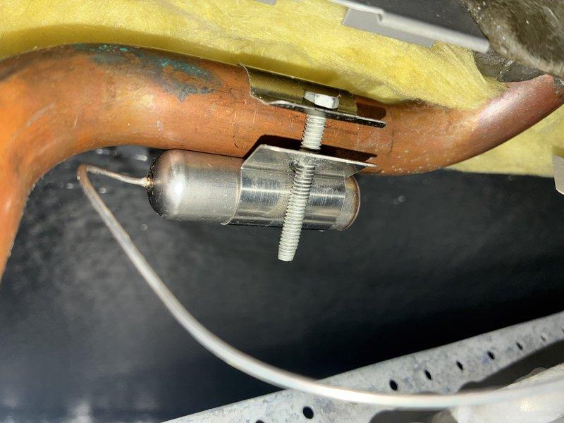 Completed MVP recurring cooling maintenance visit on 3-year-old HVAC system. Inspected air handler unit and filter assembly, noting dust accumulation on pleated media filter consistent with normal operation. Examined refrigerant line connections and union fittings at copper piping, verifying proper insulation placement and checking for signs of leaks or deterioration. All components operating within normal parameters for system age.