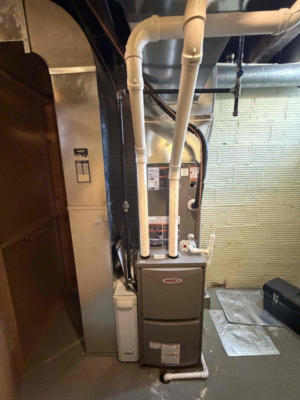 Completed installation of a 90% efficiency Lennox furnace and air conditioning system. Installed new furnace unit with proper PVC venting configuration, mounted 30-amp Littelfuse FLNR fuses in exterior disconnect, and established all necessary electrical connections with appropriate conduit routing to exterior junction box. All equipment tested and operational upon completion.