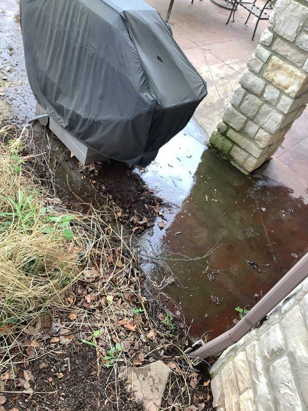 Responded to sump pump overflow and drainage blockage in 20-year-old residential property. Upon inspection, identified compromised sump pump system in basement with discharge pipe configuration issues and evidence of water intrusion around basin perimeter. Assessed exterior drainage concerns including significant standing water accumulation on patio area, indicating potential backflow or inadequate discharge routing. Cleared blockage from pump system, verified proper operation of discharge lines, and restored functionality to prevent further basement flooding and exterior water pooling.
