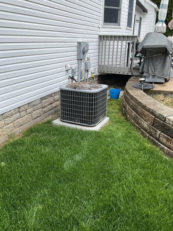 Completed routine cooling system maintenance visit on residential air conditioning unit. Performed standard preventive maintenance procedures including inspection of outdoor condenser unit, verification of proper operation, and system performance evaluation. Unit is operational and functioning within normal parameters. Noted moderate surface corrosion and rust accumulation on condenser fan grille, consistent with normal outdoor weathering on aging equipment. All essential components checked and system cleared for continued service.