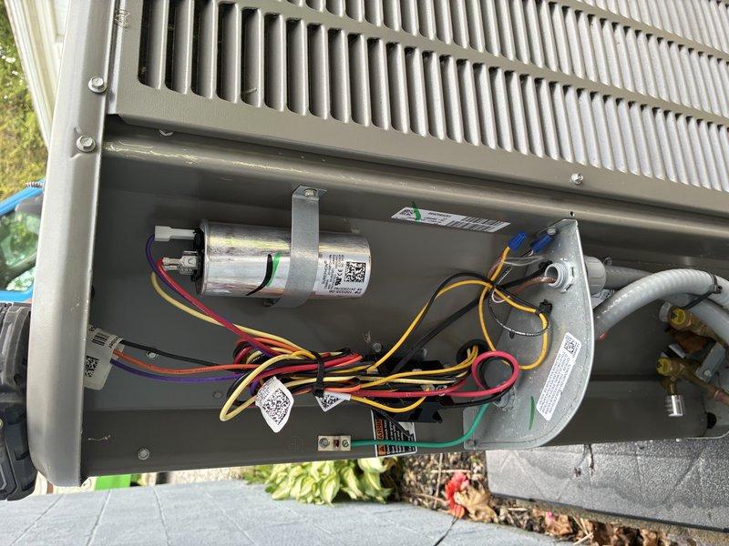 Completed routine MVP cooling maintenance visit on residential HVAC system. Performed comprehensive inspection of outdoor condensing unit, verifying proper operation of compressor, capacitor, and electrical connections. All wiring terminals showed secure connections with no signs of overheating or corrosion. Inspected indoor air handler components including evaporator coil section and humidifier pad assembly, confirming proper installation and airflow. System operating within normal parameters with no deficiencies noted. Unit ready for continued service.