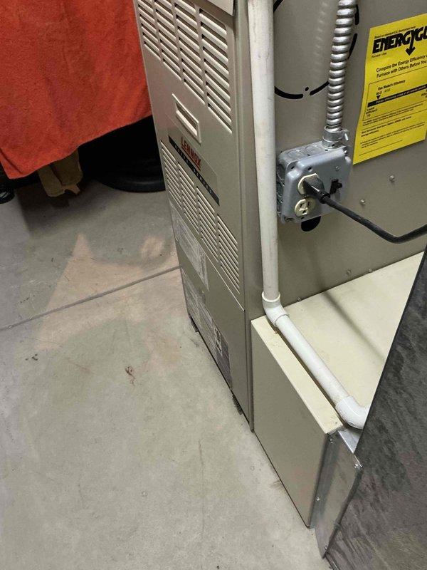 Conducted on-site evaluation for complete HVAC system replacement of 22-year-old furnace and air conditioning unit. Assessed existing equipment in basement mechanical room, including aging ductwork system with visible weathering and dust accumulation on vertical rectangular trunk line. Documented current furnace installation with beige metal cabinet, existing electrical conduit connections, PVC condensate drainage system, and associated ductwork configuration. Evaluated system accessibility, existing infrastructure compatibility, and mechanical room layout for replacement equipment installation. Provided comprehensive estimate for new furnace and air conditioning system under promotional offer.