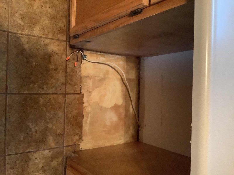 Conducted a comprehensive plumbing estimate for replacing deteriorated copper supply piping located beneath the kitchen sink and assessing requirements for new dishwasher installation. Evaluated existing under-sink plumbing configuration, including aged copper water lines showing signs of tarnish and wear, and documented current cabinet conditions with photographic evidence for accurate material and labor calculations. Prepared detailed scope of work covering removal of existing copper piping, installation of new supply lines with appropriate fittings and shutoff valves, and integration of dishwasher supply and drain connections to meet code requirements.