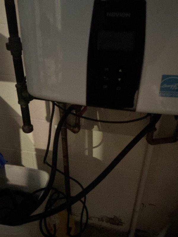 Performed descaling maintenance service on Navien tankless water heater unit. Flushed system with descaling solution to remove mineral buildup and restore optimal heating efficiency. Verified proper operation of unit and all connections upon completion.